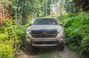 2022 Nissan Frontier tan front view on trail