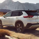 Side and Rear View of the 2022 Nissan Rogue offroading_o