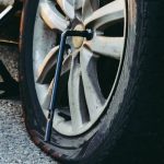 Punctured wheel, jack and lug wrench_b