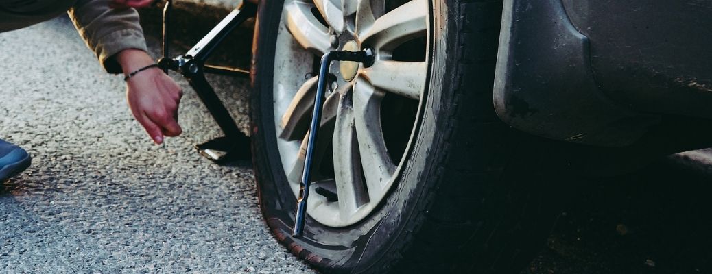 View of a flat tire being fixed