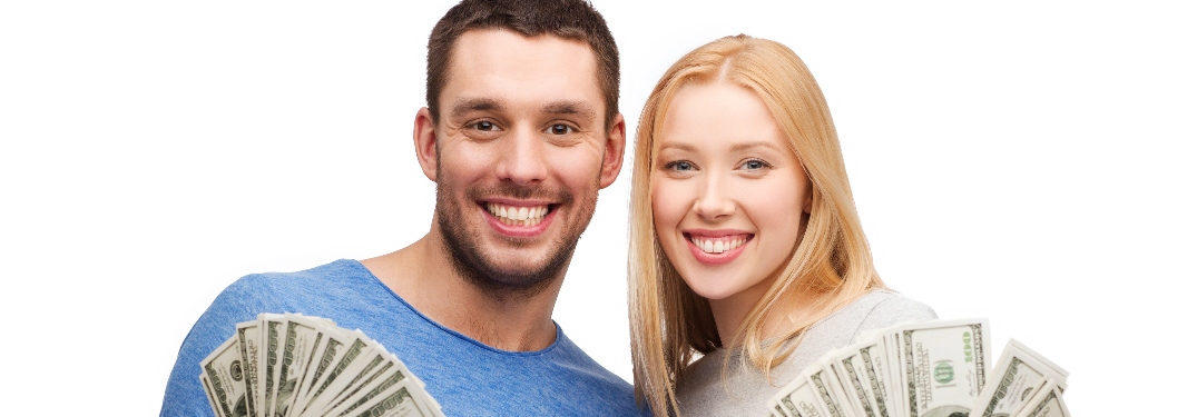 Couple holding cash
