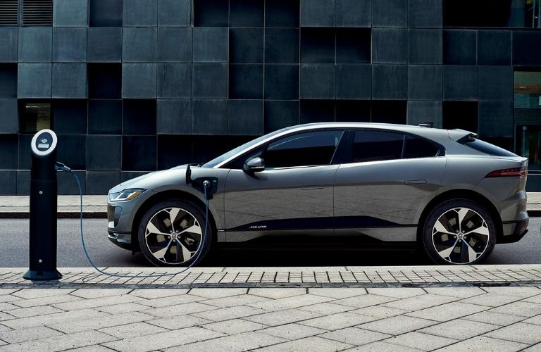 side view of the 2022 Jaguar I-Pace at a Charging station