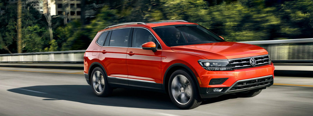 2018 Volkswagen Tiguan driving through suburban neighborhood