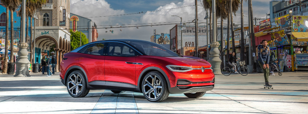 I.D. CROZZ concept electric suv parked in tropical city
