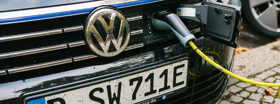Volkswagen vehicle being charged electrically through grille cap