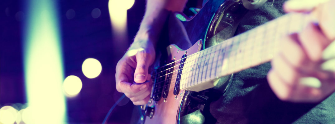 Isolated image of guitar playing at festival