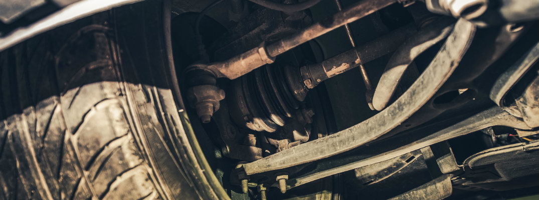 Closeup view of used vehicle sway bar and stabilizer links