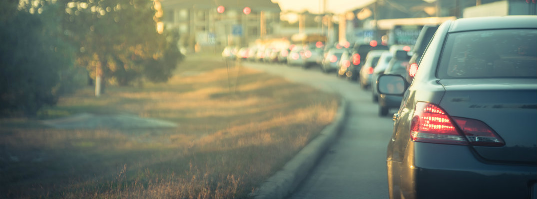 Line of vehicles stopped on busy road