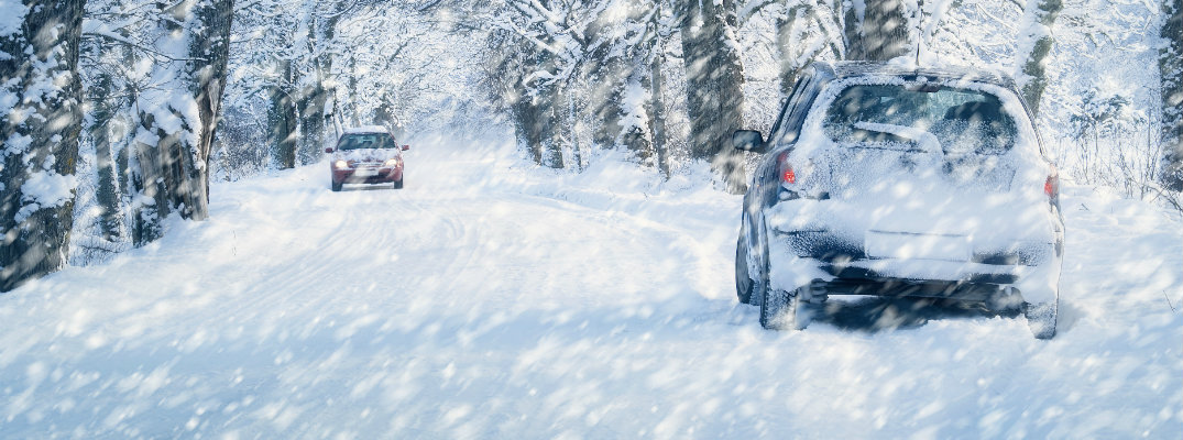 Two cars on a snowy road