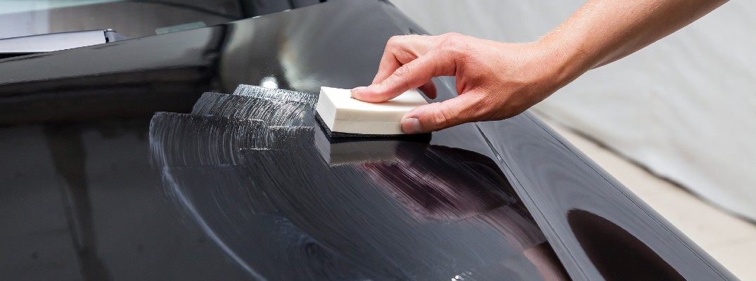 Polish being applied to the hood of a car