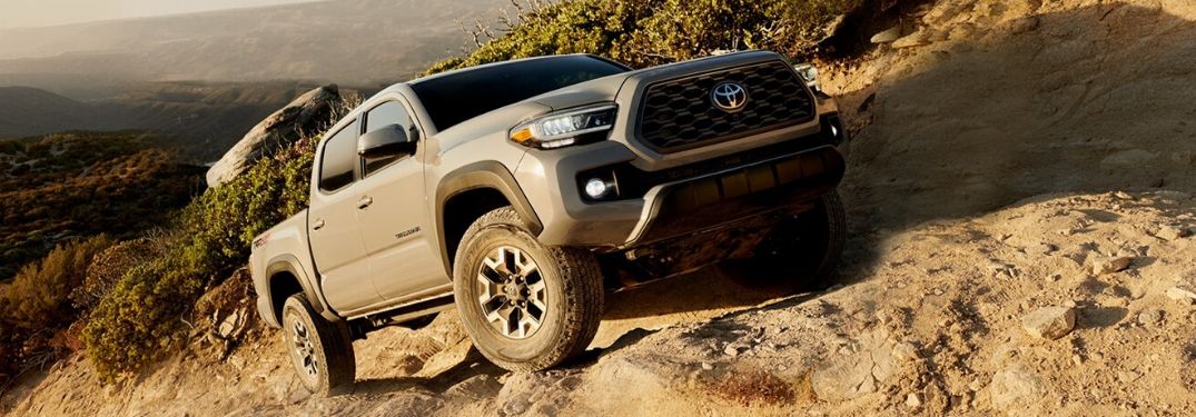2020 Toyota Tacoma climbing up rocky terrain from exterior front drivers side