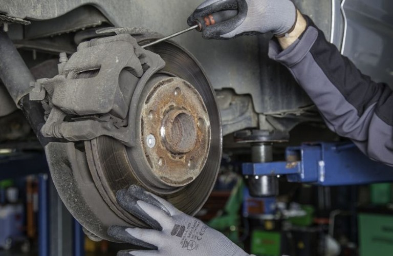 Mechanic working on brake