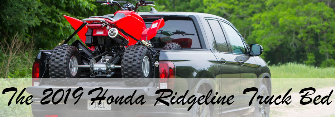 image of the 2019 Honda Ridgeline with a four-wheeler secured in the truck bed with text saying: "The 2019 Honda Ridgeline Truck Bed"