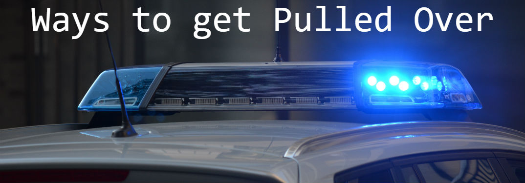 Common Reasons to be Pulled Over with image of flashing lights on top of a police cruiser