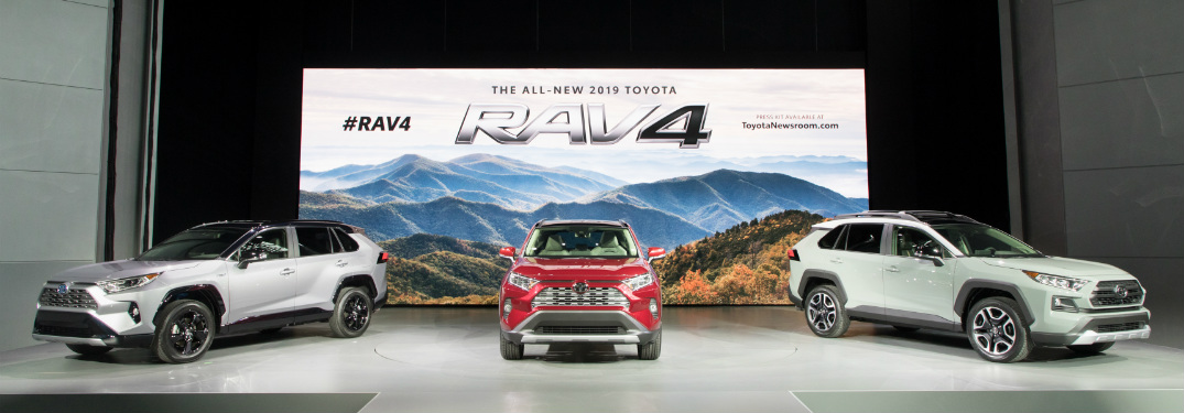silver, red and white 2019 toyota rav4 on display at 2018 new york international auto show