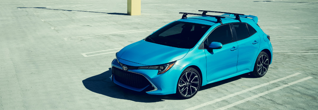 blue 2019 toyota corolla hatchback in empty parking lot