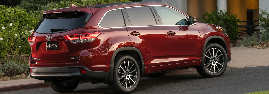 rear view of red 2018 toyota highlander in driveway