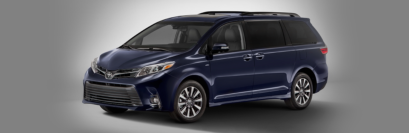 Black 2018 Toyota Sienna on a grey background