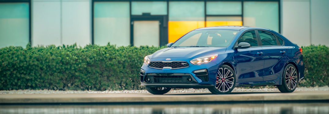 2020 Kia Forte blue exterior front fascia driver side parked by pond