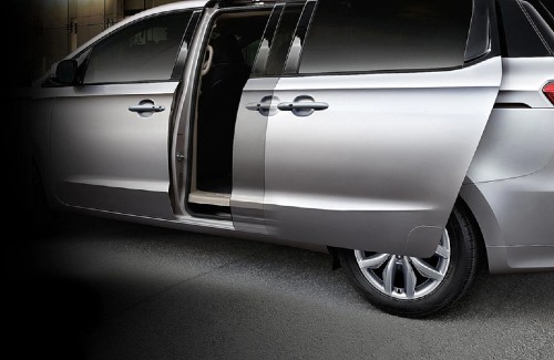 2021 Kia Sedona silver exterior driver side rear sliding door opening