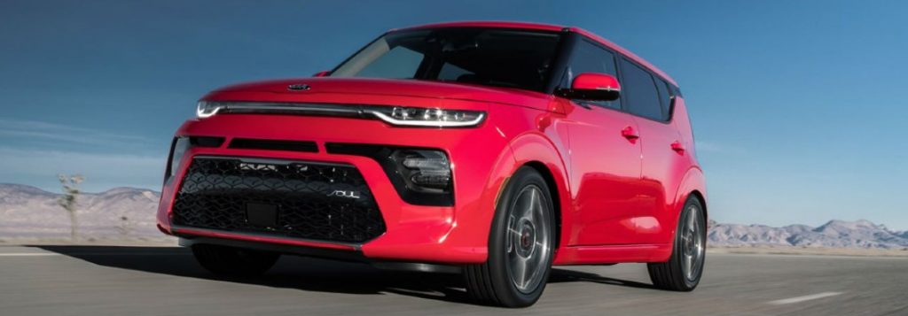 2021 Kia Soul red exterior front fascia driver side driving in desert area
