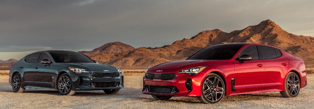 two 2022 Kia Stinger models parked in desert