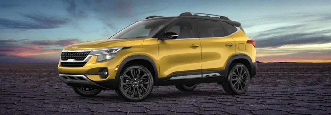 Image of a yellow 2022 Kia Seltos Nightfall Edition on a rugged terrain with beautiful sky in the background