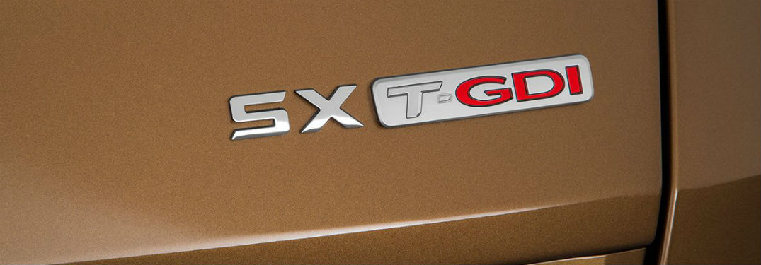 closeup photo of SX Turbo badge on 2019 Kia Sportage