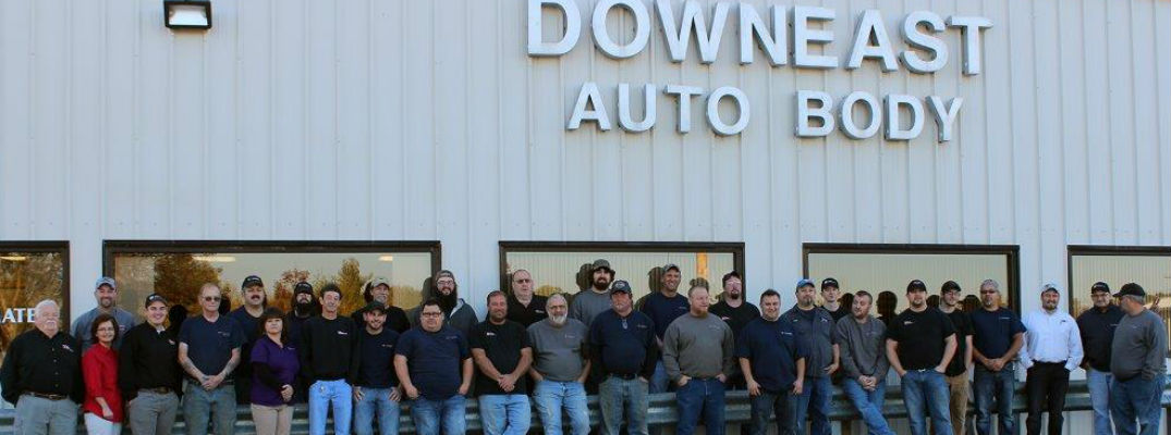 Downeast Auto Body Service Team Standing in Front of Downeast Auto Body Building