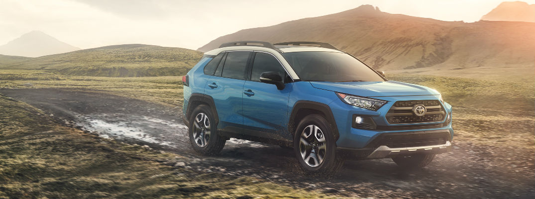 Blue 2019 Toyota RAV4 with AWD in the Mud
