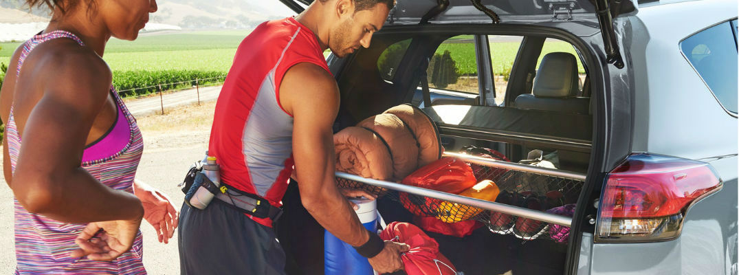 Man and Woman Loading Cargo in a 2018 Toyota RAV4
