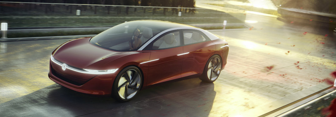 red-Volkswagen-I.D.-VIZZION-concept-driving-over-bridge