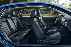 Interior showing dash, front and back seats from passenger side