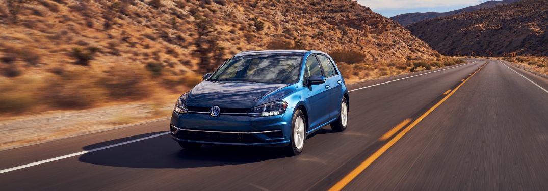 Blue 2021 Volkswagen Golf on highway