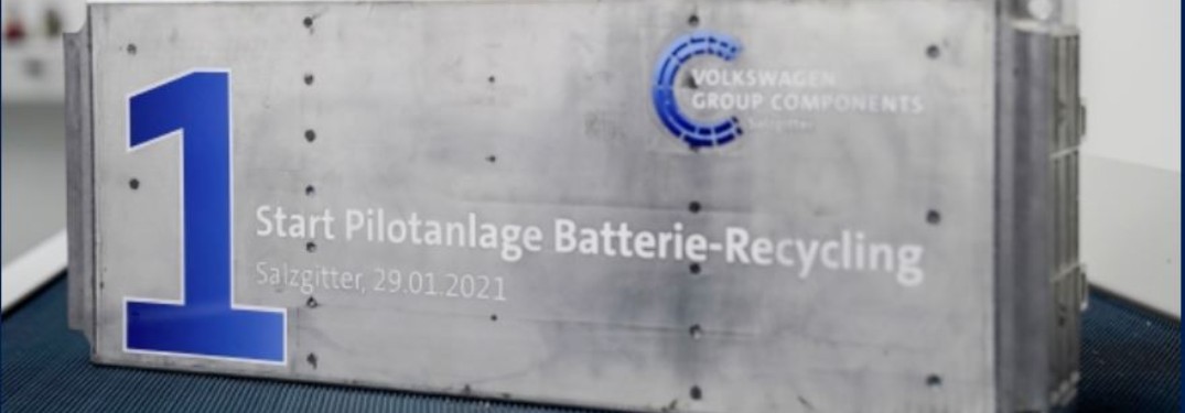 A plaque stating when the EV battery pilot recycling program started and who is running it