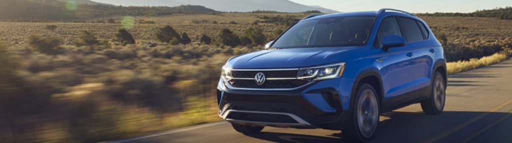 2021 Volkswagen Taos driving on a rural road