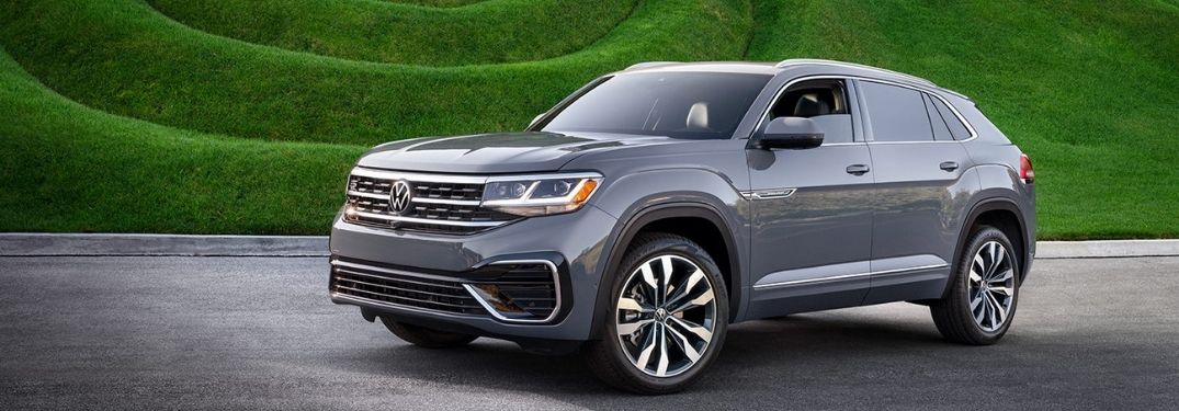 The 2022 Volkswagen Atlas Cross Sport on a smooth road backdropped by greenery