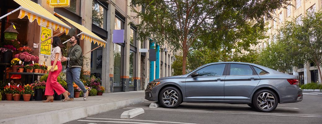 2022 Volkswagen Jetta Side View parked near a flowe shop