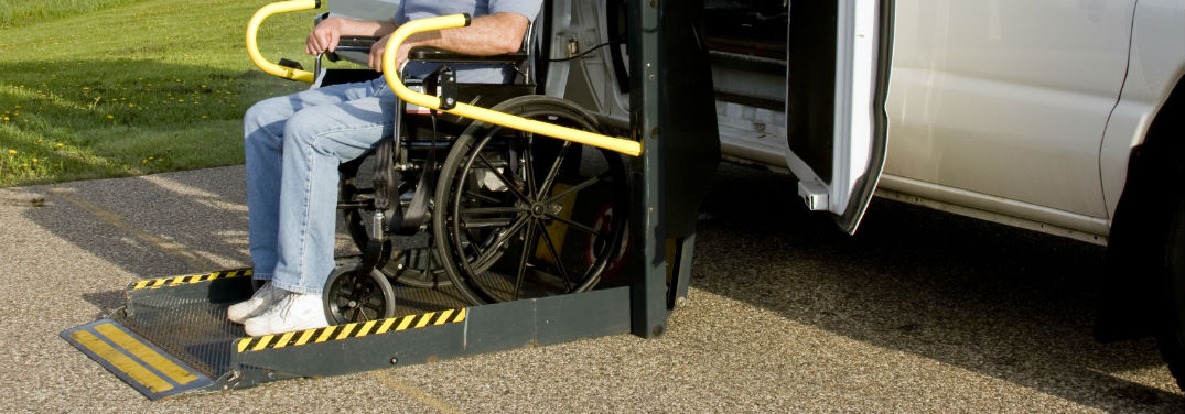 Mazda Mobility Program Cash Bonus with image of a person using a wheelchair lift on a van