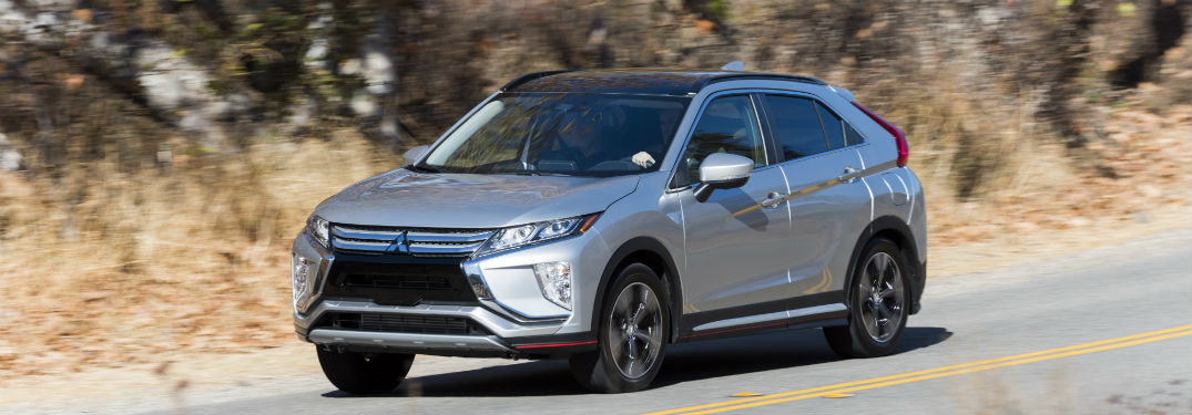 2018 Mitsubishi Eclipse Cross exterior front fascia and drivers side going fast on road