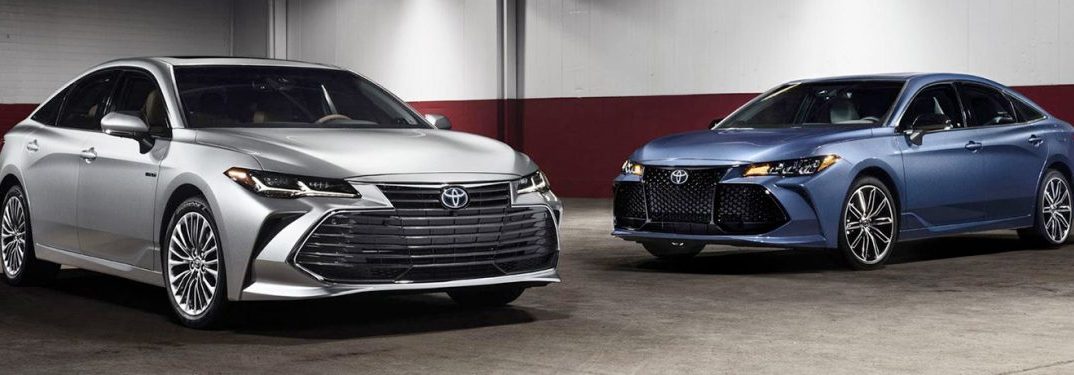 two 2019 Toyota Avalon models parked in a parking garage next to each other