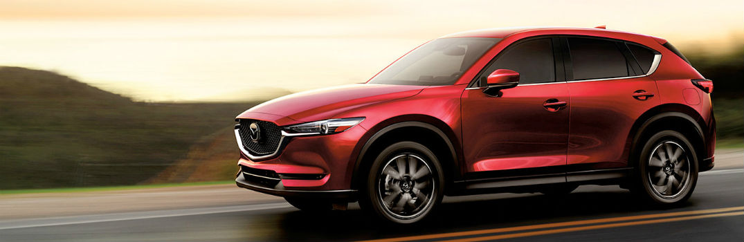 red 2018 CX-5 on the road