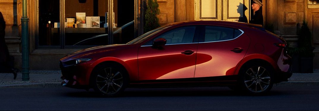 2020 Mazda3 parked next to city curb