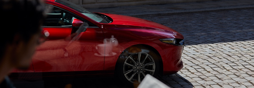 2020 Mazda Hatch front end seen through cafe window