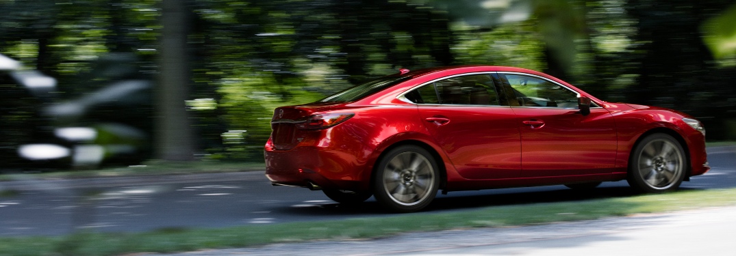 2021 Mazda6 driving on wooded road
