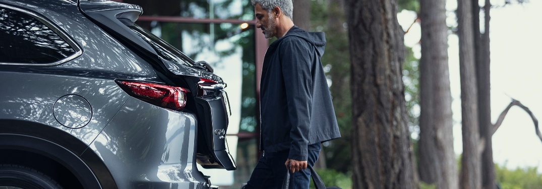 man loading 2021 CX-9 cargo bay