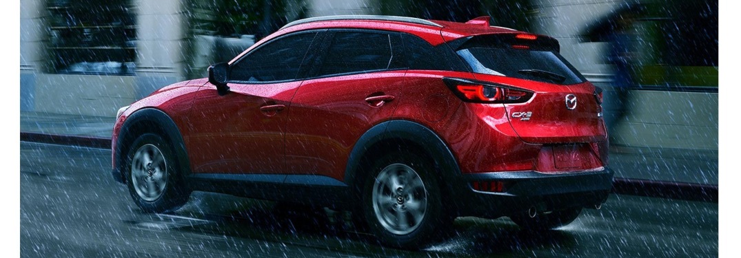 2021 Mazda CX-3 driving away in the rain