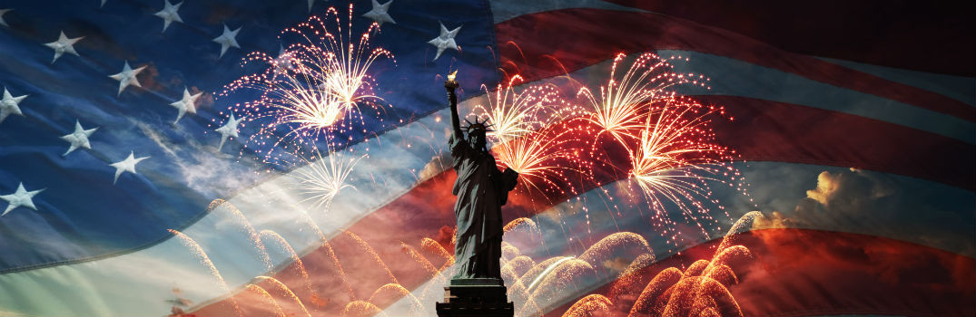 statue of liberty and fireworks in front of american flag background