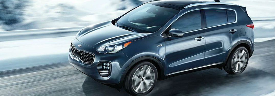 Kia Sportage driving on a road