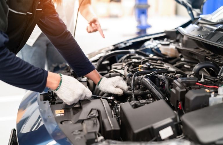 Person Working On An Engine B - Motion Kia